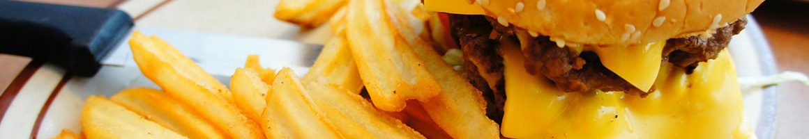 Eating American (Traditional) Burger at Scotty's Drive In restaurant in Idaho Falls, ID.